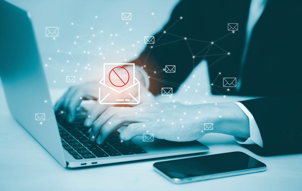 Email concept with laptop spam and virus computer monitor internet security concept, businessman reading electronic mail with a laptop. Spam, junk and e-marketing on screen, Spam Email Pop-up Warning.